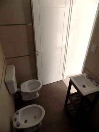 DEPARTAMENTO 2 AMBIENTES AL FRENTE CON PATIO. PLANTA BAJA, DTO A, 58M2. TEMPERLEY.